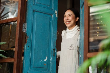 Woman smiling in door frame