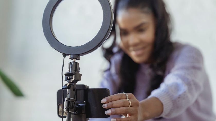 Smiling woman creating a Video
