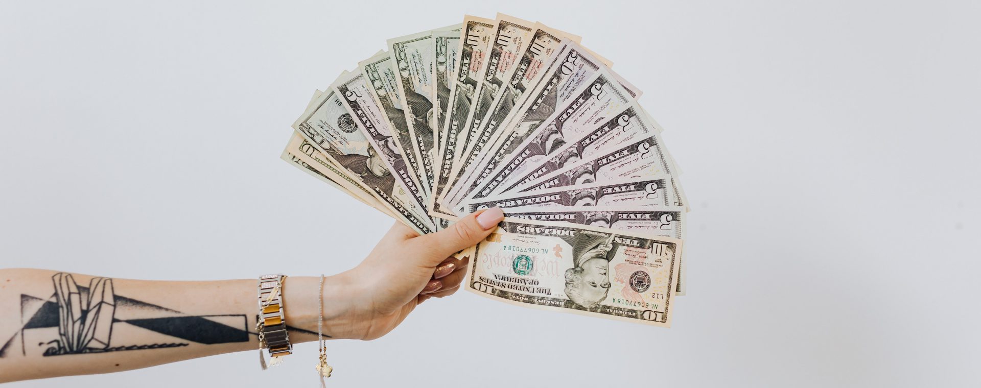woman holding a money fan